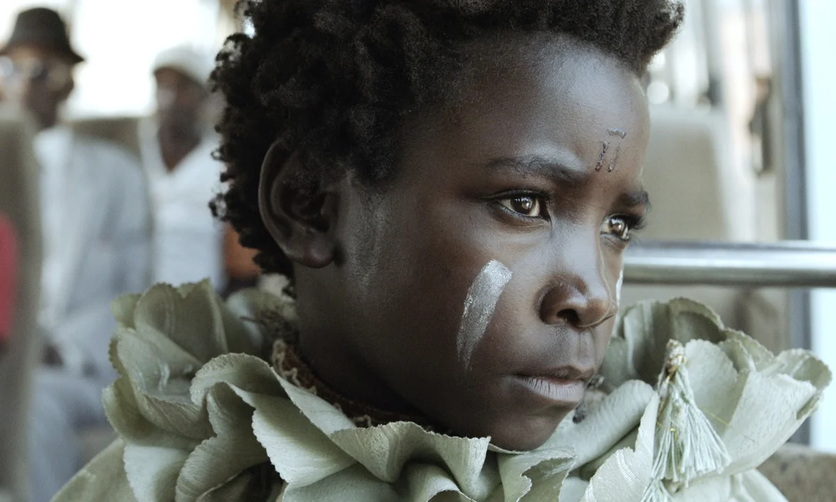 Young witch in a bus