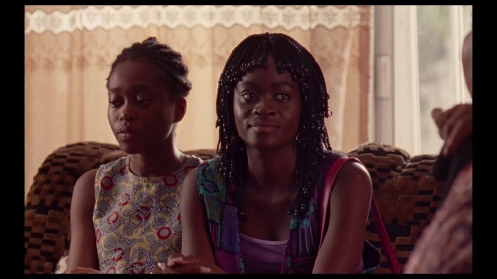 Two young women on a couch
